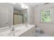 Bathroom featuring a double vanity and shower/tub with new shower curtain at 1703 Berwickshire Cir, Raleigh, NC 27615