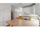 Kitchen area featuring white cabinetry, an island, and modern appliances at 1703 Berwickshire Cir, Raleigh, NC 27615