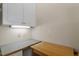 Efficient laundry area with counter space, overhead cabinets, and bright lighting at 1703 Berwickshire Cir, Raleigh, NC 27615