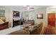 Cozy living room featuring a fireplace with built-in TV and comfortable seating at 1703 Berwickshire Cir, Raleigh, NC 27615