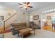 Bright living room featuring a staircase, comfortable seating, and an adjacent dining area at 1703 Berwickshire Cir, Raleigh, NC 27615