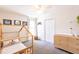 Charming bedroom features a stylish bed frame and a modern changing table at 1816 Piperwood Ct, Durham, NC 27713