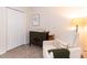 Bedroom with charming dresser, cozy chair and natural light at 1816 Piperwood Ct, Durham, NC 27713