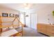 Bright bedroom with wood frame bed, modern furniture and large closet at 1816 Piperwood Ct, Durham, NC 27713