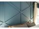 Close up of the trending blue wall accent that makes this main bedroom pop! at 1816 Piperwood Ct, Durham, NC 27713