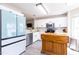 Modern kitchen with stainless appliances, ample storage, and light-filled space for cooking enjoyment at 1816 Piperwood Ct, Durham, NC 27713
