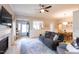 Bright living room open to dining area, featuring hardwood floors, fireplace, and neutral decor at 1816 Piperwood Ct, Durham, NC 27713