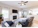 Bright living room features fireplace, hardwood floors, and open layout for easy entertaining at 1816 Piperwood Ct, Durham, NC 27713