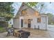 Cozy backyard with patio, firepit and string lights. Perfect for entertaining at 1917 Washington St, Durham, NC 27704