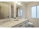 Bathroom with double sink vanity with marble top and stylish chrome faucet at 1917 Washington St, Durham, NC 27704