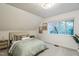 Bright bedroom with carpeted floor, paneled ceiling, and a large window with natural light at 1917 Washington St, Durham, NC 27704