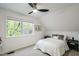 Bedroom with carpeted floor, paneled ceiling, fan and large window at 1917 Washington St, Durham, NC 27704