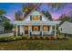 Charming home with a inviting front porch and beautiful landscaping, perfect for enjoying outdoor living at 1917 Washington St, Durham, NC 27704