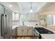 Updated kitchen featuring stainless steel appliances, sleek countertops, and modern white cabinetry at 1917 Washington St, Durham, NC 27704