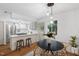 Eat-in kitchen with stainless appliances, gas cooktop, breakfast bar, and a cozy dining area at 1917 Washington St, Durham, NC 27704