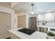 Modern kitchen with stainless appliances, gas cooktop island, and ample cabinet space at 1917 Washington St, Durham, NC 27704