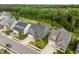 Aerial shot features a well-manicured front yard, a spacious driveway, and a landscaped garden at 192 Logbridge Rd, Chapel Hill, NC 27516