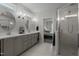 Contemporary bathroom design with dual sinks, stylish lighting, and a glass-enclosed shower at 192 Logbridge Rd, Chapel Hill, NC 27516