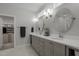 Bright bathroom featuring dual vanities, modern lighting, and ample storage space at 192 Logbridge Rd, Chapel Hill, NC 27516