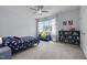 Inviting bedroom with a ceiling fan, large window and comfortable furniture, a perfect space for relaxation at 192 Logbridge Rd, Chapel Hill, NC 27516