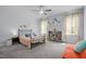 Cozy bedroom with plenty of natural light and playful decorations, perfect for a room at 192 Logbridge Rd, Chapel Hill, NC 27516