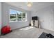 Bright bedroom featuring a large window overlooking the neighborhood and a TV for entertainment at 192 Logbridge Rd, Chapel Hill, NC 27516