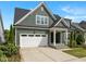 Charming two-story home with a beautiful lawn, inviting front porch, and a convenient attached two-car garage at 192 Logbridge Rd, Chapel Hill, NC 27516