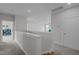 Bright hallway with gray walls and a view of a room with a ceiling fan at 192 Logbridge Rd, Chapel Hill, NC 27516