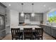 Stylish kitchen featuring quartz countertops, pendant lighting, and stainless steel appliances at 192 Logbridge Rd, Chapel Hill, NC 27516