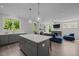 Open-concept kitchen with island seating flows into the living area, great for entertaining and Gathering gatherings at 192 Logbridge Rd, Chapel Hill, NC 27516