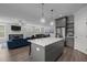 Open-concept kitchen with island seating flows into the living area, great for entertaining and Gathering gatherings at 192 Logbridge Rd, Chapel Hill, NC 27516