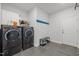 A well-organized laundry room with modern washer and dryer units at 192 Logbridge Rd, Chapel Hill, NC 27516