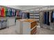 Spacious walk-in closet with custom organizers, shelving, and center island for ample storage at 192 Logbridge Rd, Chapel Hill, NC 27516