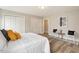 This bedroom features two closets, two chairs and minimalist decor and ample natural light at 1969 Bowles Ave, Creedmoor, NC 27522