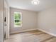 Cozy bedroom with wood floors and a window view of the outdoors at 1969 Bowles Ave, Creedmoor, NC 27522