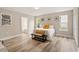 Bright bedroom with light wood flooring and natural light from multiple windows at 1969 Bowles Ave, Creedmoor, NC 27522