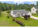 Charming single-story home featuring stone accents and a well-manicured lawn with mature trees at 1969 Bowles Ave, Creedmoor, NC 27522