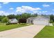 Well-maintained house with driveway and lush green lawn in a serene setting at 1969 Bowles Ave, Creedmoor, NC 27522