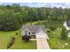 A lovely single-Gathering home with a well-kept lawn, set against a backdrop of dense trees at 1969 Bowles Ave, Creedmoor, NC 27522