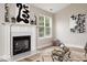Living Room fireplace with white mantle and decorative art pieces at 1969 Bowles Ave, Creedmoor, NC 27522