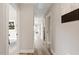 Neutral-toned hallway features clean lines, modern lighting, and seamless access to various rooms at 1969 Bowles Ave, Creedmoor, NC 27522