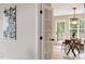 View from living room toward bright eat-in kitchen and outdoor access at 1969 Bowles Ave, Creedmoor, NC 27522
