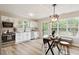 Eat-in Kitchen with white cabinetry, stainless appliances, and lots of sunlight at 1969 Bowles Ave, Creedmoor, NC 27522