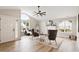 Bright living room with large windows, wood floors, and modern decor at 1969 Bowles Ave, Creedmoor, NC 27522