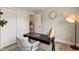 This home office features a wooden desk, a cozy gray chair, and great lighting at 1969 Bowles Ave, Creedmoor, NC 27522