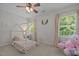 Cozy bedroom with unique bed frame, plush rug and natural light from the window at 2012 Sterling Hill Dr, Fuquay Varina, NC 27526