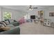 Spacious bonus room with a large sectional sofa and built-in shelving with toys at 2012 Sterling Hill Dr, Fuquay Varina, NC 27526