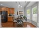 Bright dining area features a round table, natural lighting, and a wine rack at 2012 Sterling Hill Dr, Fuquay Varina, NC 27526