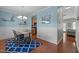 Charming dining room with wainscoting, light blue walls, wood floors, and stylish decor at 2012 Sterling Hill Dr, Fuquay Varina, NC 27526
