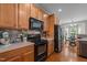 Well-lit kitchen features stainless steel appliances, beautiful wood cabinets, and an eat-in breakfast area at 2012 Sterling Hill Dr, Fuquay Varina, NC 27526